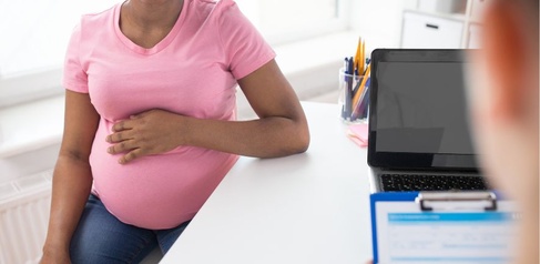 Pregnant woman visiting a dr